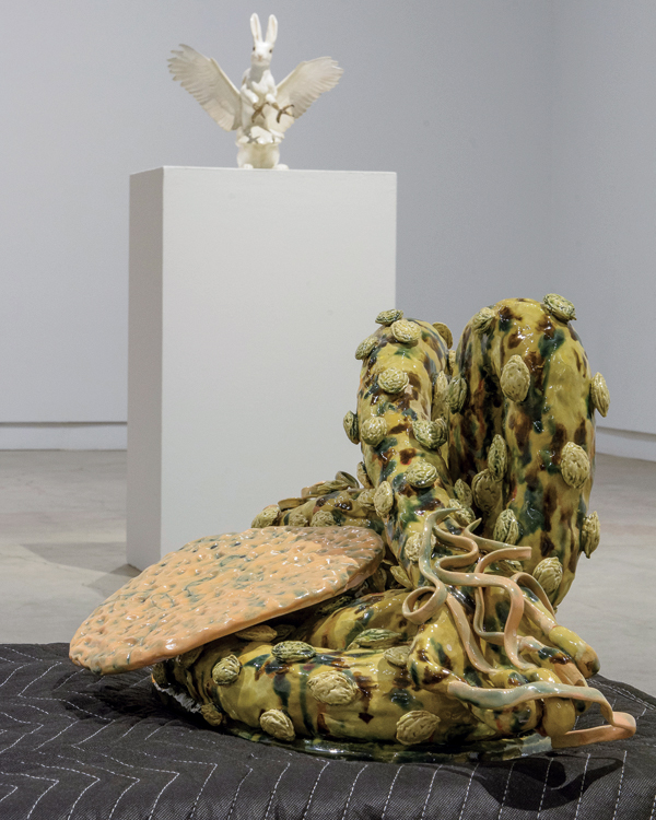4 Foreground: Cathy Lu’s American Dream Pillow, 6 ft. 5 in. (1.9 m) in width, glazed ceramic, cinder blocks, moving blankets, 2021. Background: Debra Broz’ Predator & Prey, 18 in. (46 cm) in width, ceramic, sculpting compound, paint, 2022. Photo: Diana Jahns. 