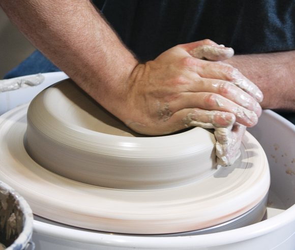 1 Start by centering around 8 pounds of clay and opening for a wide base.