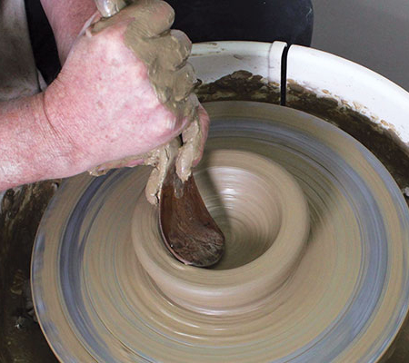 1 Center and open 3 pounds of clay as you would any bowl form, then use a rib to compress the bottom.