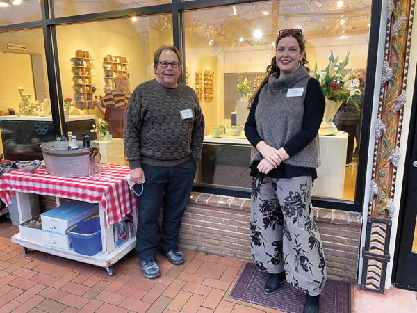 1 Loren Lukens and Deb Schwartzkopf outside the entrance for the new Rain City Clay. 