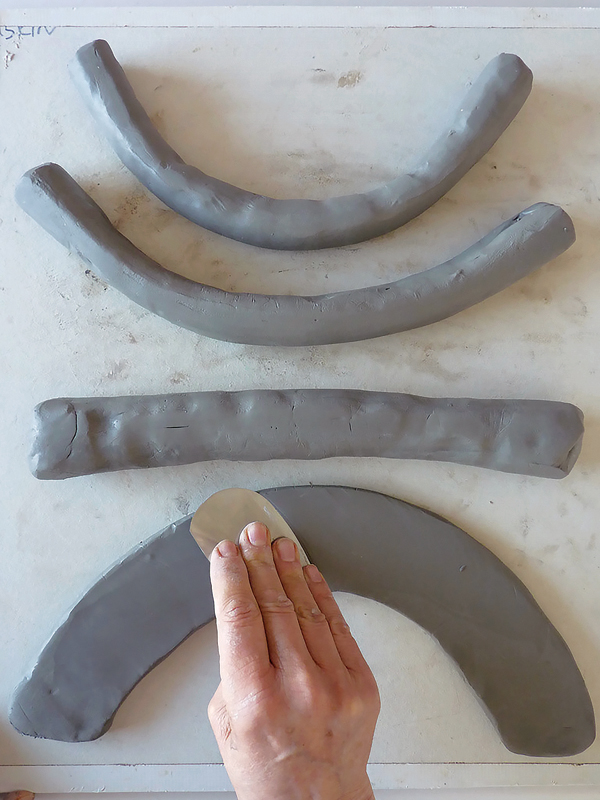 1 Straight coils make cylinders. The curvier the arc, the more angled the cone will be.