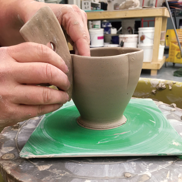1 Throw a smooth, narrow-based cup and indent the top with a rib.