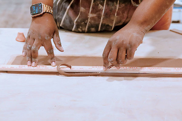2 Use a ruler and needle tool to cut the stamped slab so that it measures approximately 28 inches in length and 3½ inches in height. 