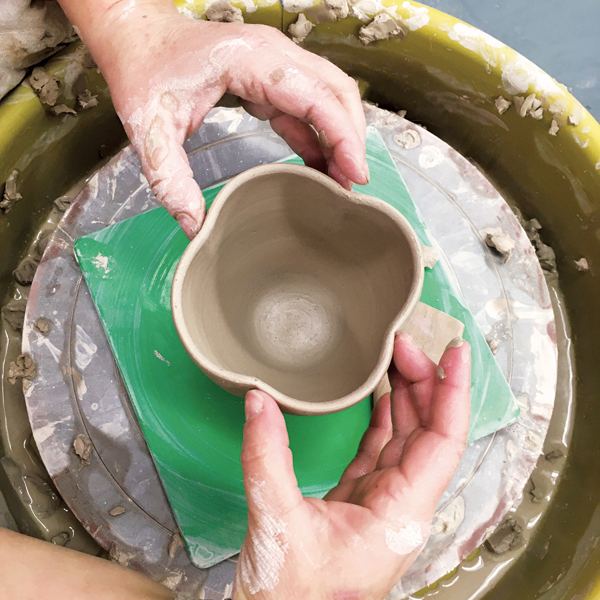 2 Place a fingertip in each indentation on the rim. Gently nudge to even them out.
