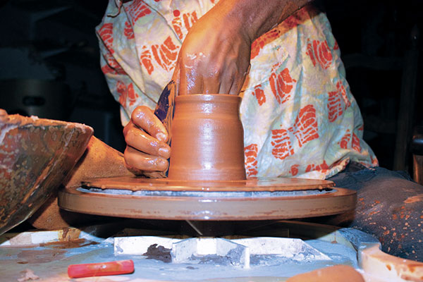 3 Refine the shape of the cylinder to narrow slightly at the lip.