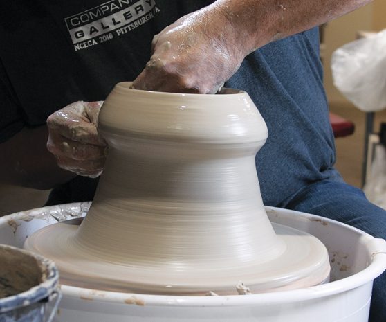 3 Center and throw around 6 pounds of clay into a bottomless cone.
