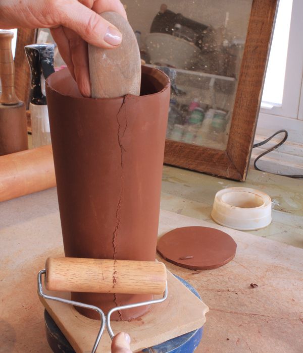 3 Support the interior surface of the seam while you compress the outer surface with a pony roller. 
