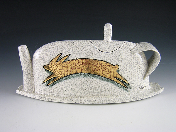 3 Rimas VisGirda’s Running Rabbit with Shadow, 8½ in. (22 cm) in length, slab-built porcelain with decomposed granite, wax inlay, underglaze pencil, crazing glaze, lusters, overglaze, 2011. 
