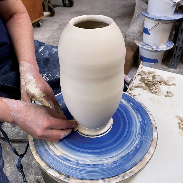 4 Use your a sponge to define the foot. Once it’s leather hard, roll the bottom on a table to help round off the edge.