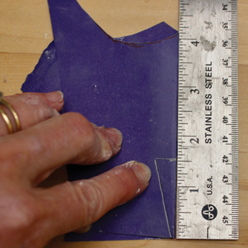 5 Fold poster board and mark the edge the same measurement as the neck height.