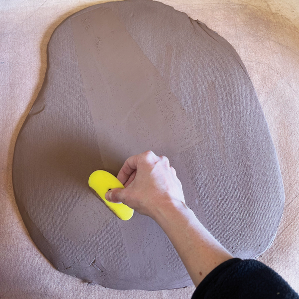 5 Clean and compress the slab using a rubber rib.