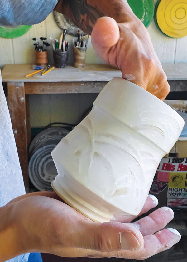 5 Rotate the yunomi using your palm and hand on the inside to decorate new areas.