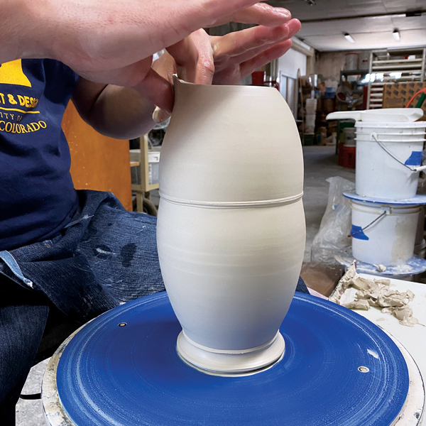 5 Pulling the spout takes practice. Keep your hands wet and work toward creating a thin and clean edge.