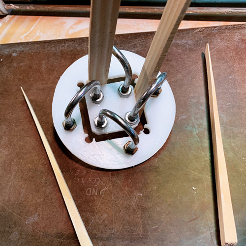 5 Attach the center section using U-bolts. Use shims as spacers.