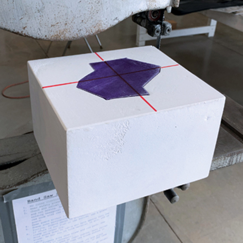 5 Once it is dry, draw lines to indicate where to cut the mold with a bandsaw.