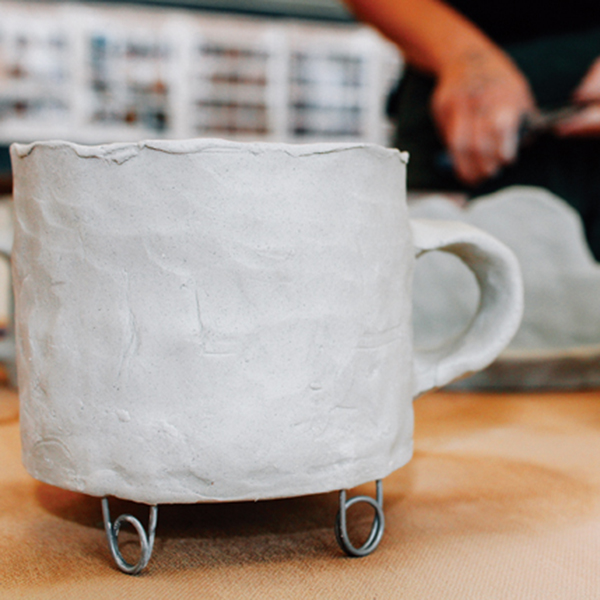 5 Flip the cup over and test it to make sure it is level. Dry and bisque fire the cup.
