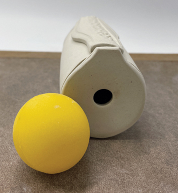 6 Use either a ball or your hand to slightly indent the base around the hole.