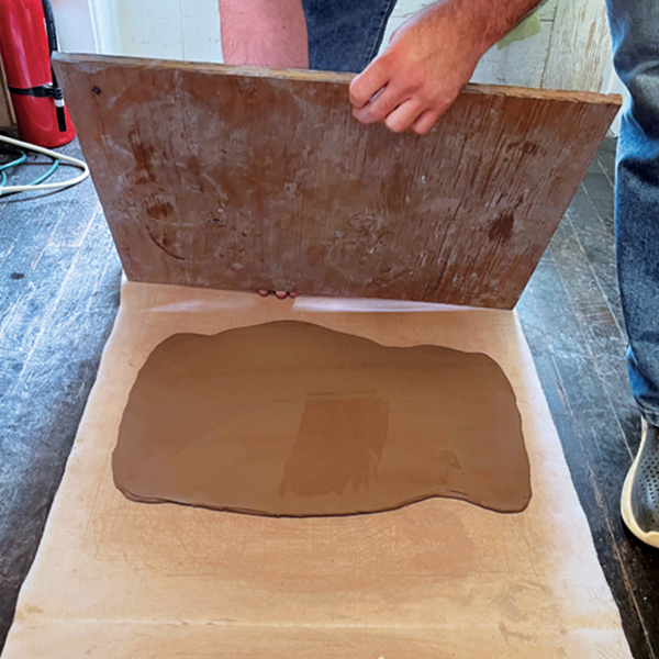 6 Place a ware board on top of the slab and  wrap the slab and ware board together.