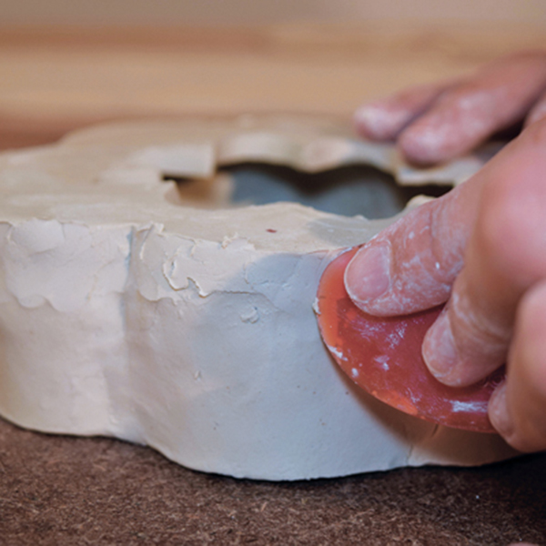 6 Blend the base into the walls with a small rubber rib. 