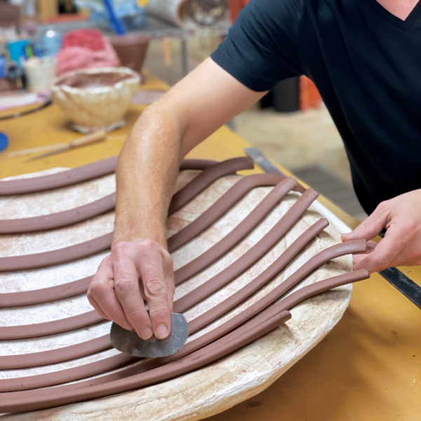 6 Score the first layer to get ready to attach the next layer of perpendicular coils.
