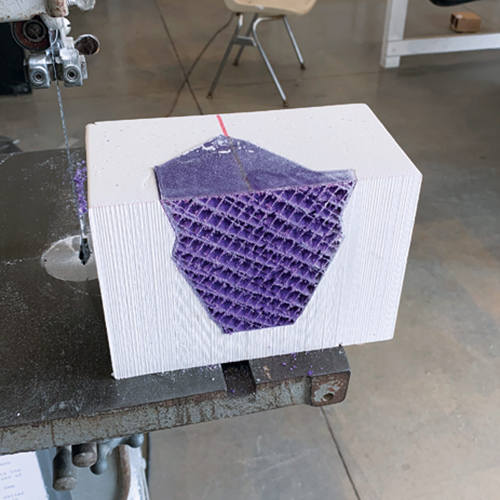 6 Make the first cut. Because of the form’s complexity, the mold must be four parts.