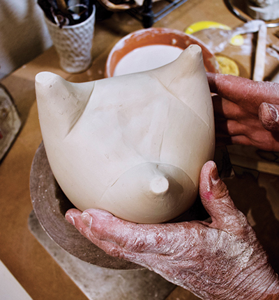 9 Continue the creases from the bottom of the form up the sides.