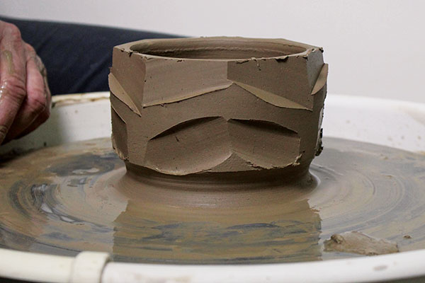 7 Make faceted cuts around the top half of the bowl in a zig-zag pattern, then make matching cuts on the lower half of the bowl.