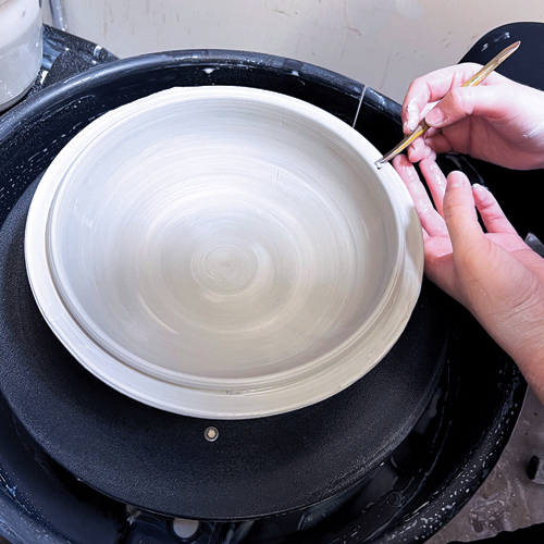 7 Throw a shallow bowl with excess clay in the rim. Split the rim out at least ½ inch.