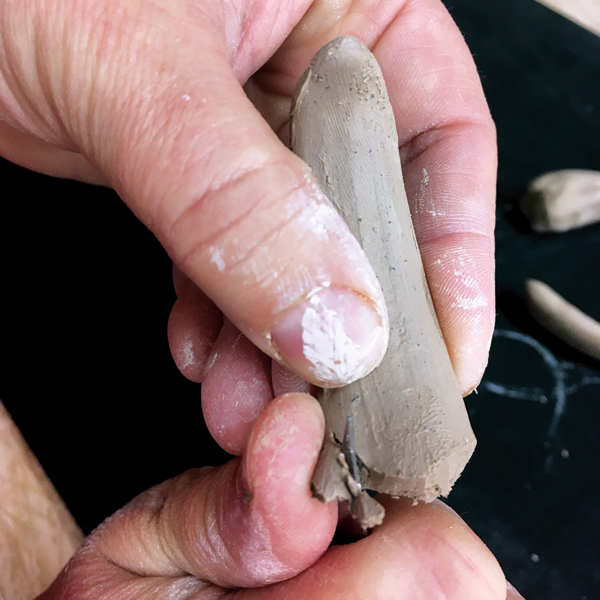 7 Cut both ends of the smaller handle so it is roughly a comma shape.