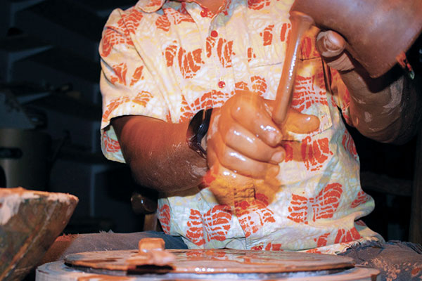 8 With a little bit of water, pull the handle to thin it, but do not overwork it.