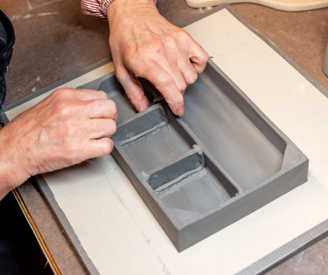 8 Divide the box in two parts lengthwise with an added slab and then add smaller slabs to divide one side into three parts.