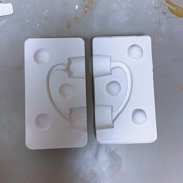 8 Both sides of the completed and cleaned plaster handle mold.