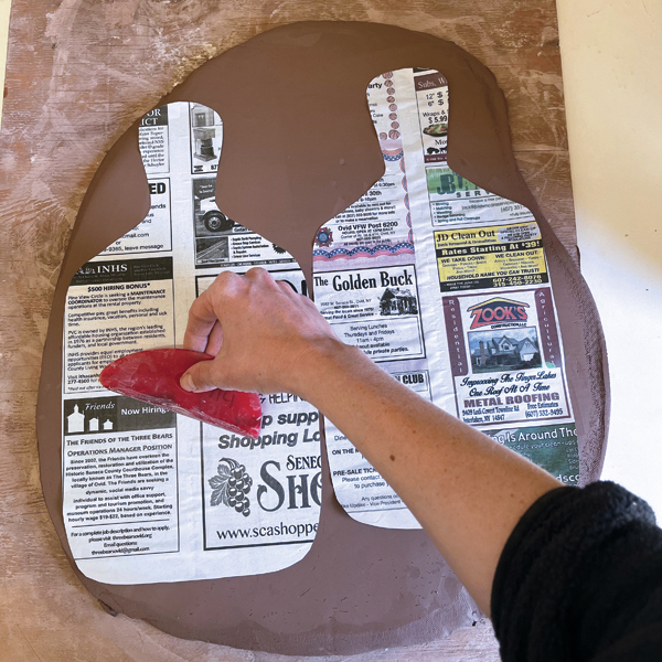 8 Smooth the template onto the slab with a rubber rib or your fingers.