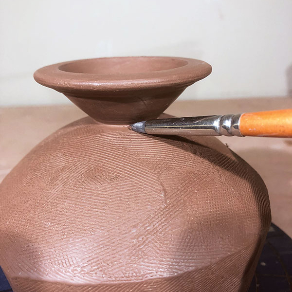 9 Use a serrated rib to refine the surface, then compress the foot attachment.