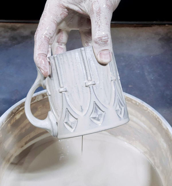 9 Wait until the mug is bone dry, then dip it into terra sigillata.