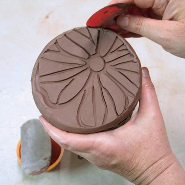 9 Attach the foot to the body by scoring and slipping, then smooth the seam.