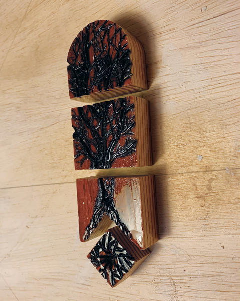 9 I use a wood burner to design seed, roots, trunk, and treetop stamps.