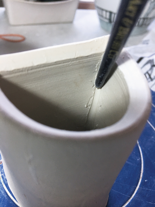 9 Smooth the seams on the inside using the round end of a paintbrush.