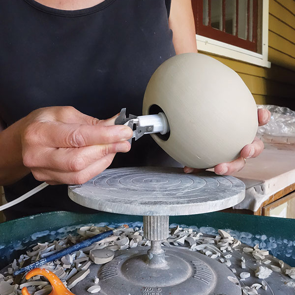 4 Prepare nightlights by cutting a hole at the base for the socket to clip into.