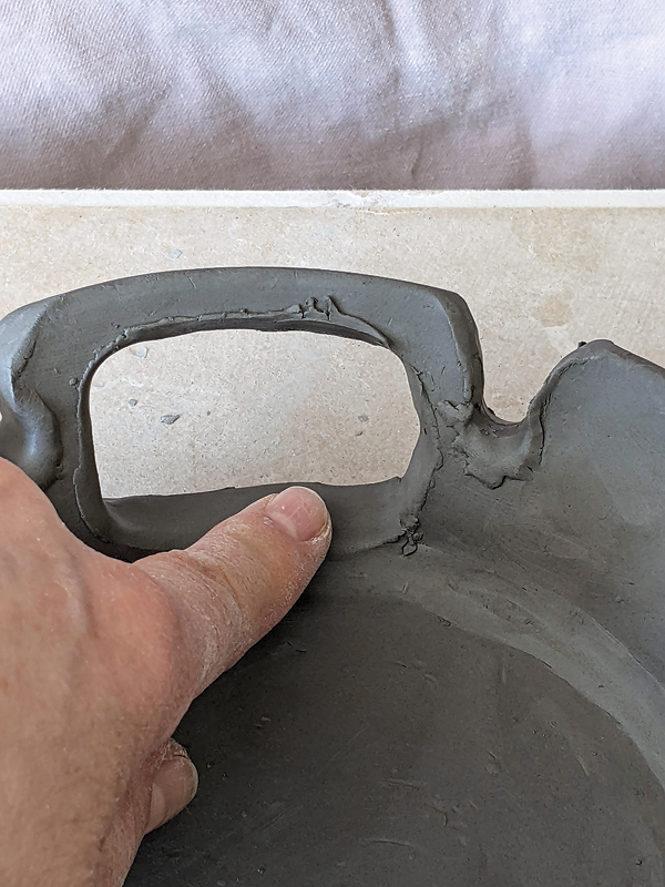 10 Leave a slightly raised edge around each opening to catch underglaze.