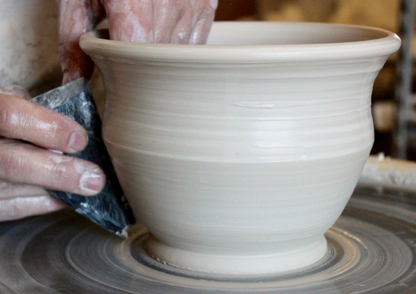10 Move the rib up and press into the edge from the inside of the bowl to shape the pot’s profile.
