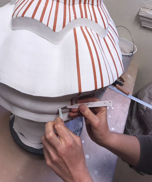 10 Apply three coats of white glaze, then peel the tape off.