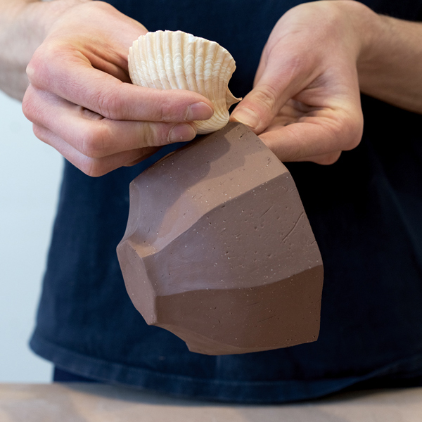 11 Add texture to the bowl by pressing objects into the thicker portions of the form.