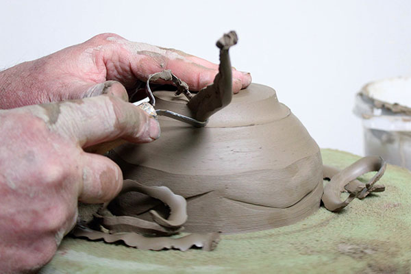 11 When the bowl is leather hard, trim it on a foam bat to protect the undulating rim.