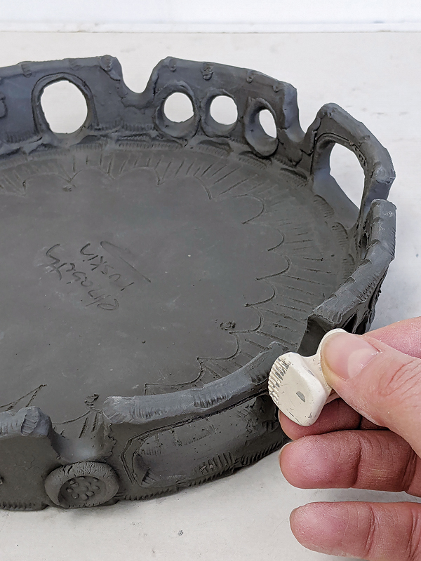 11 Continue layering decorative elements on the skirt. Alter it, stamp it, add sprigs.
