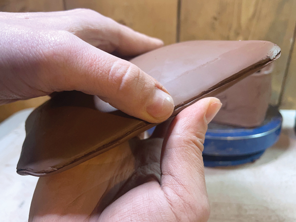 11 Position both rectangles so the curved sides are facing out and they form a pocket of space between them.