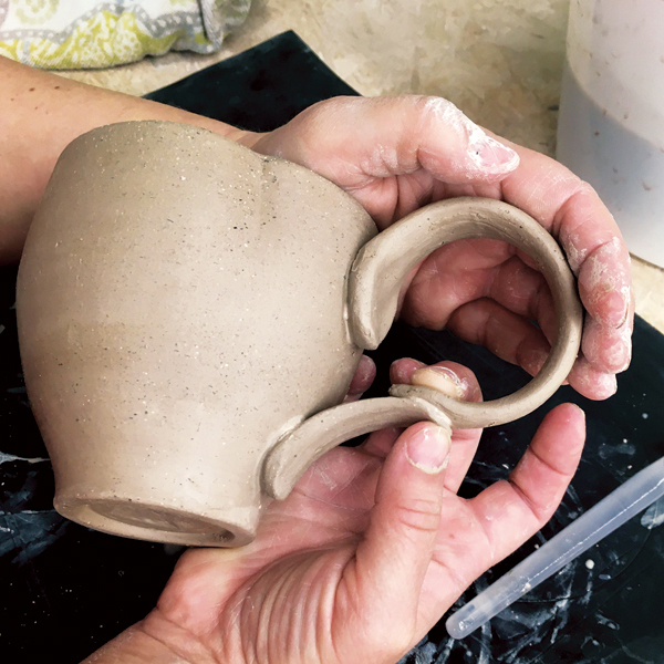 11 Score and slip the thin ends of the handles and firmly pinch them together.