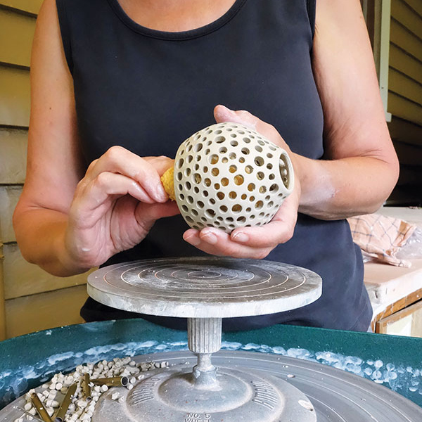 6 After carving the entire form, smooth the surface with a moist sponge.