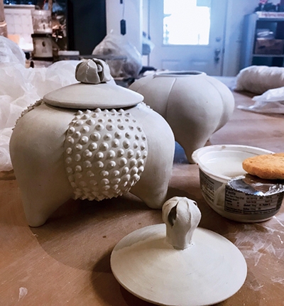 12 Use a sponge to soften the slip-trailed dots once leather hard.