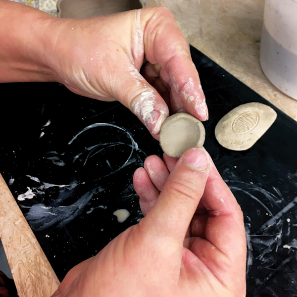 12 Make the thumb rest for the top of the handle from a ball of clay.